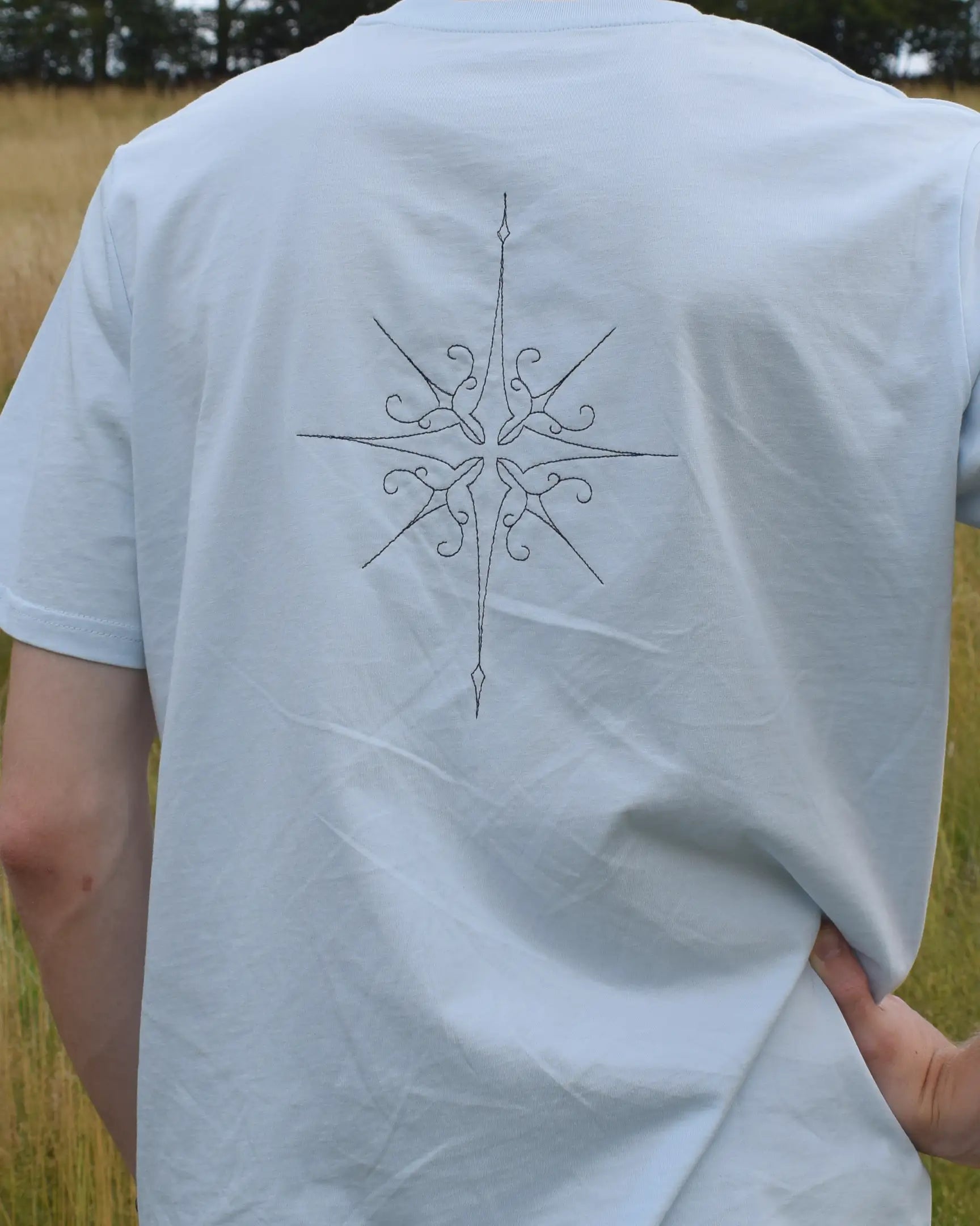 star embroidery tshirt compass design elbow out