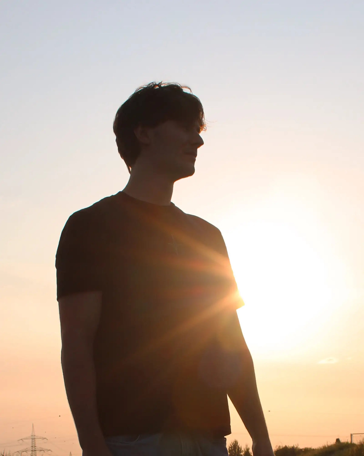 Young man posing in the sunrise