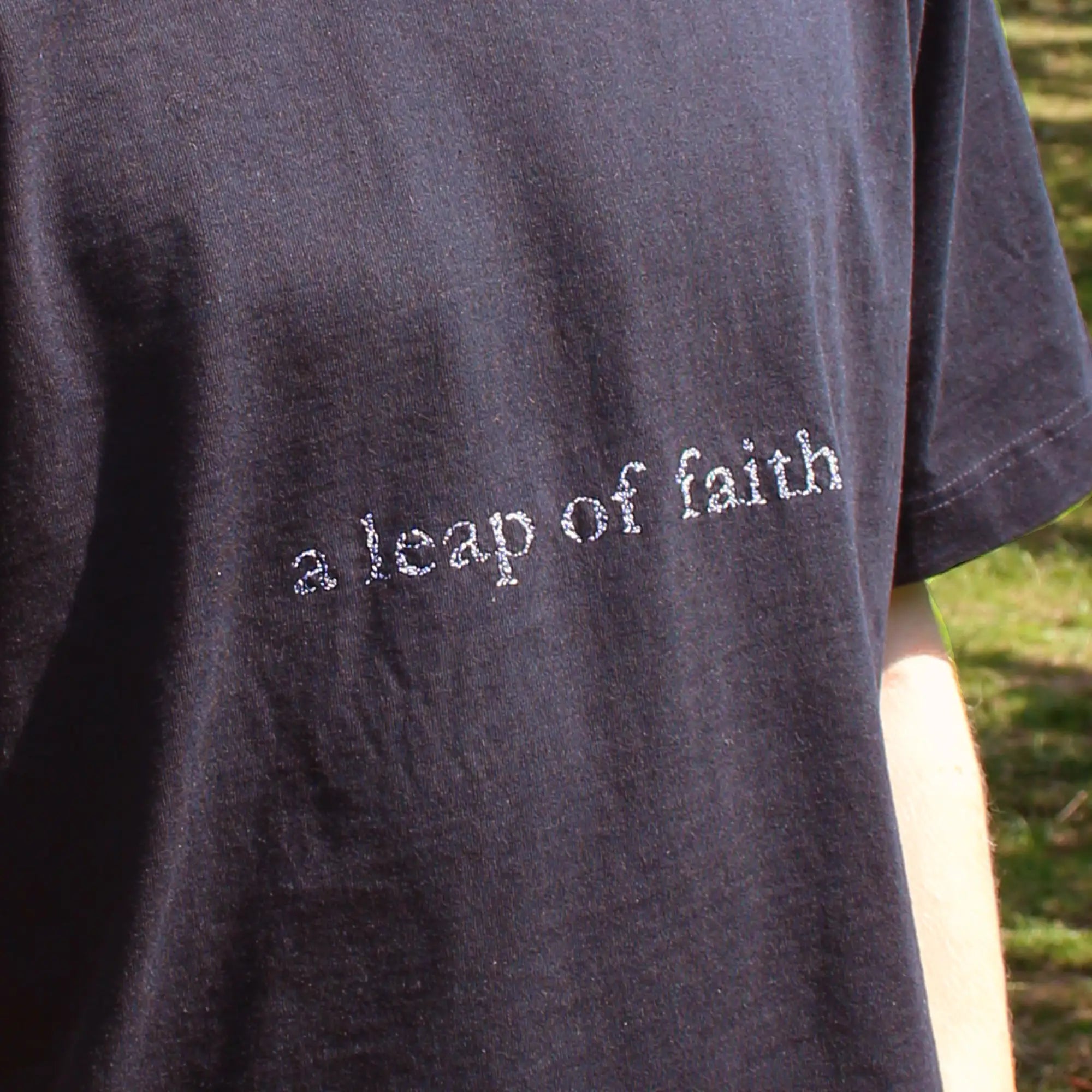 'A LEAP OF FAITH' HEAVYWEIGHT TEE IN BLACK