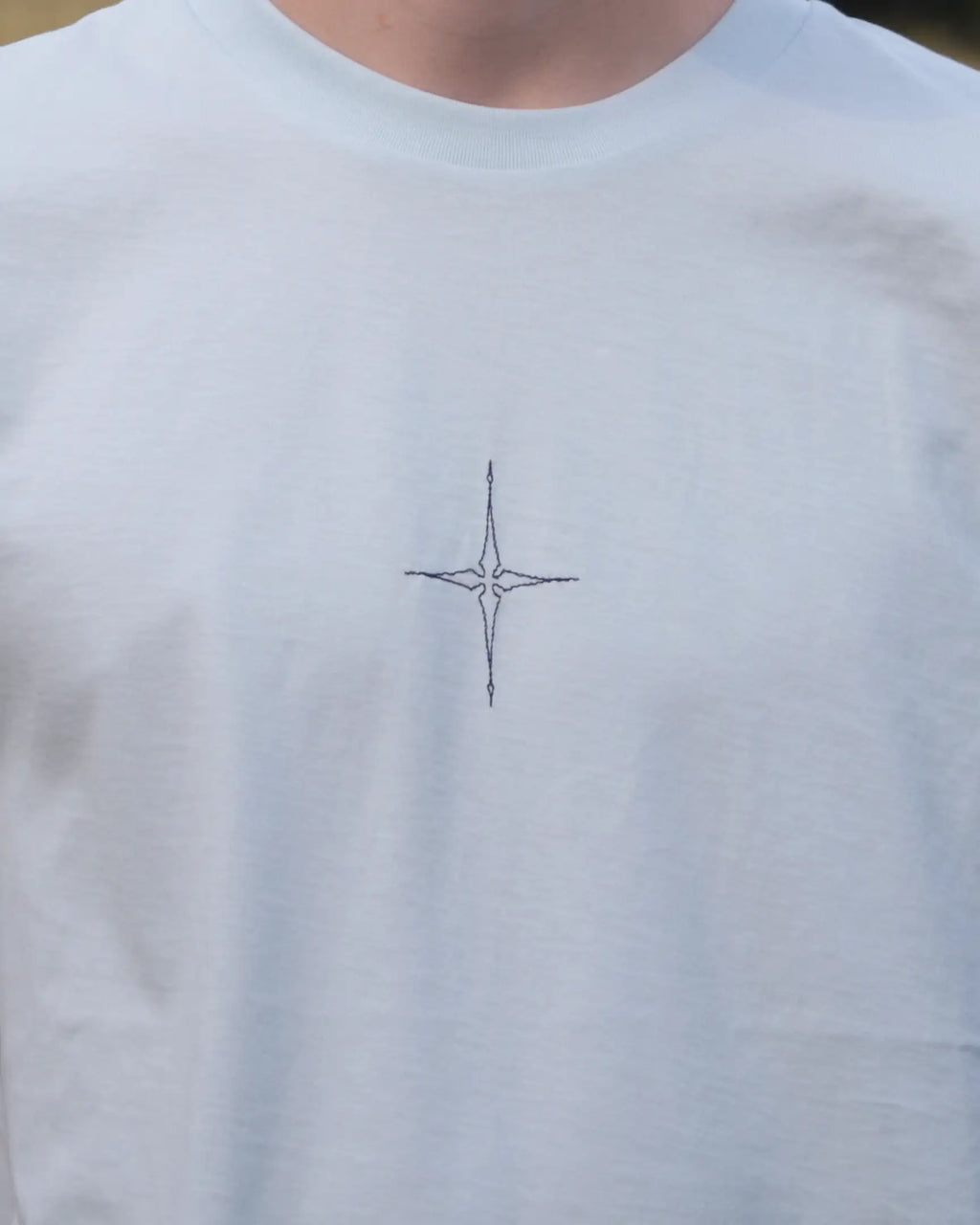 star embroidery tshirt compass design close up front