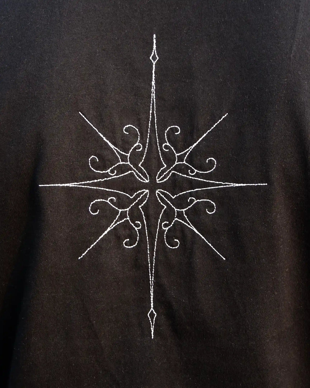 star embroidery tshirt in black close up back