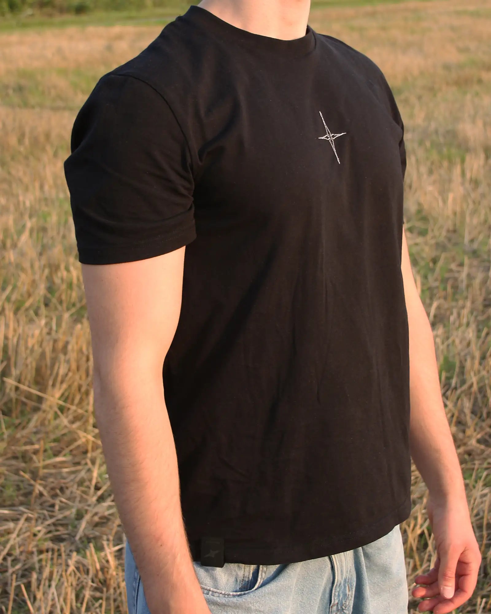 star embroidery tshirt in black side profile frontview with label