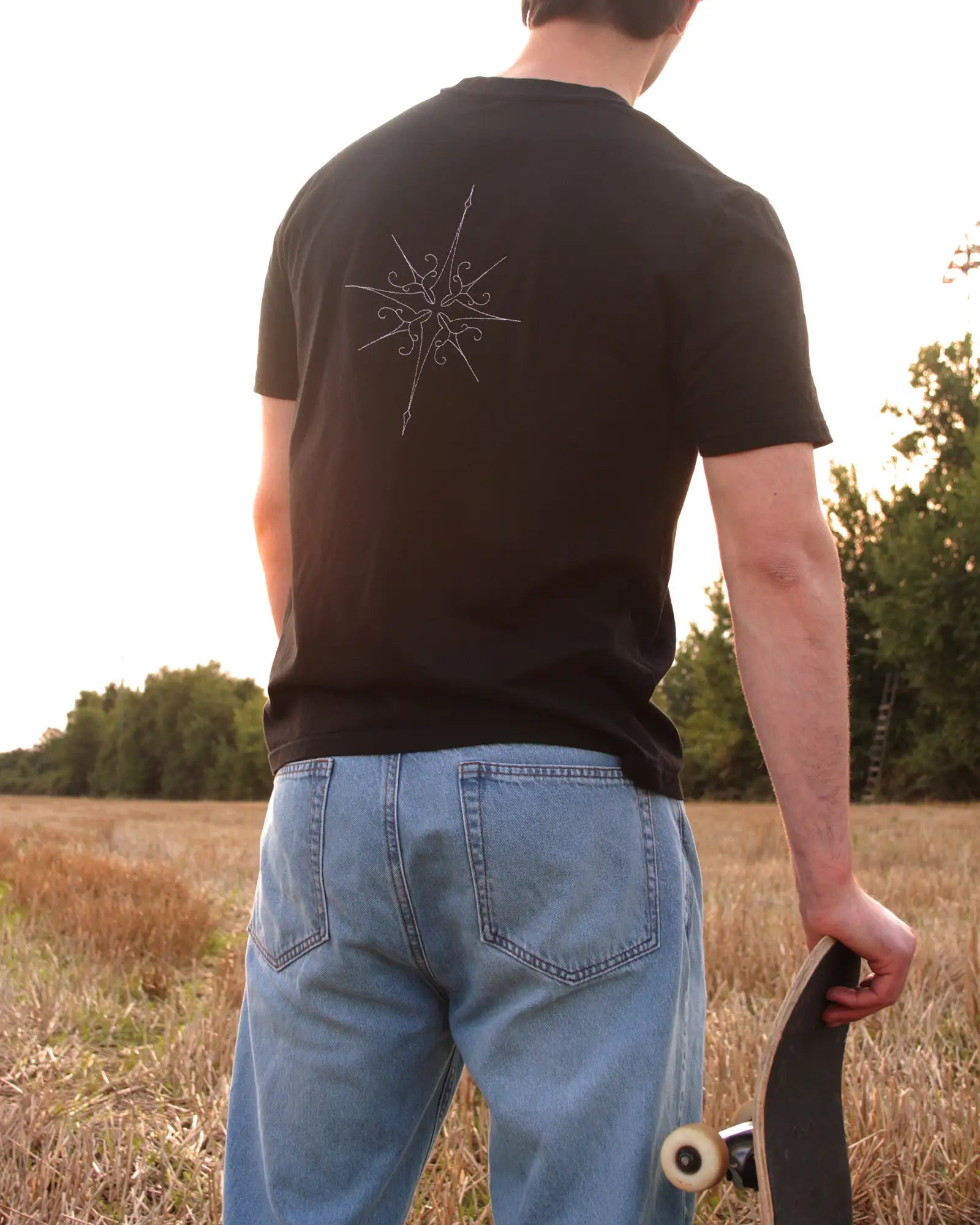 star embroidery tshirt in black with skateboard